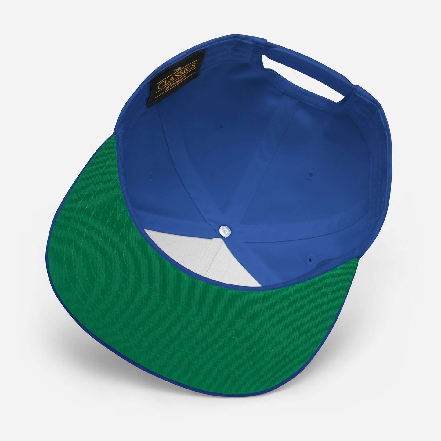 Flat Bill Cap with a green undervisor and blue crown view from above.